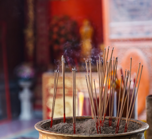 Burning Incense in Chinese Buddhist Temple background