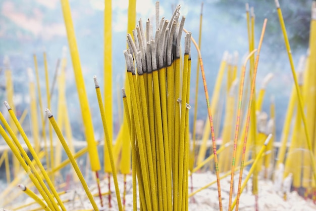 Burning incense sticks during prayer at Po Lin Monastery in Hong Kong Hong Kong is popular tourist destination of Asia