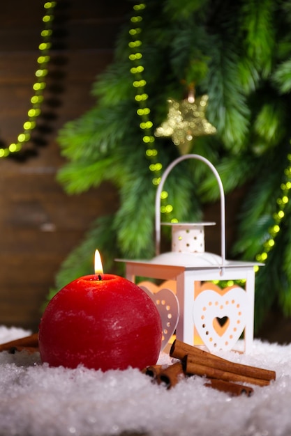 Burning lantern on wooden background