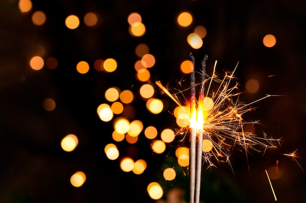 burning sparkler in a christmas atmosphere at night