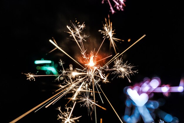 Burning sparkler isolated on black