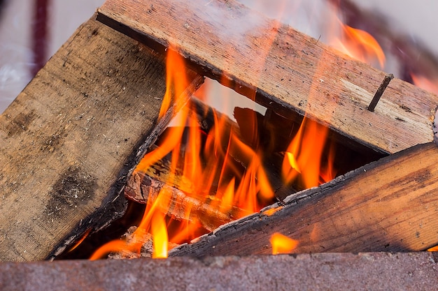 Burning wood in a brazier