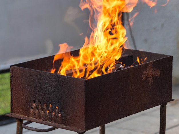 Burning wood in a brazier