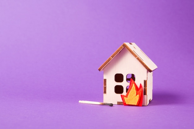 Burning wooden model of a house