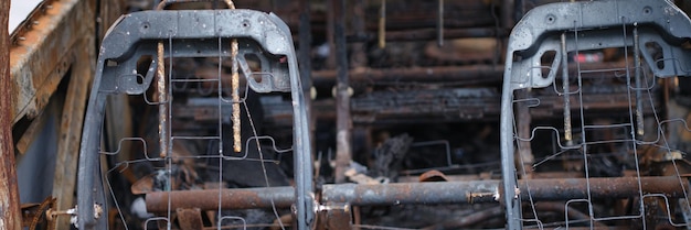 Burnt rusty car after fire or accident