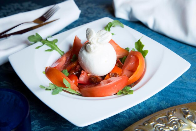 Burrata salad The burrata is a fresh cow's milk cheese with spun paste and round in shape