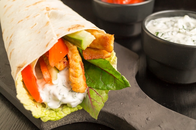 Burrito with grilled chicken and vegetables (fajitas, pita bread, Shawarma)