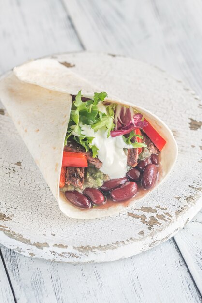 Photo burrito with meat and guacamole