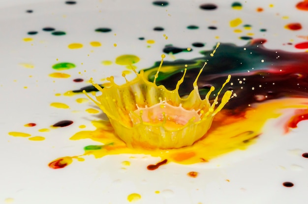 Bursts of multicolored bright colors of paint in the form of crowns and colorful splashes