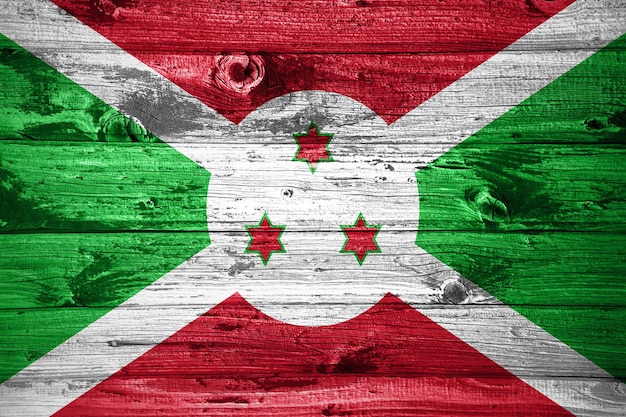 Burundi flag on wooden planks background wood flag