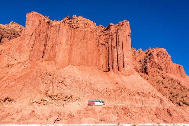 Bus and dramatic red cliffs in bolivia