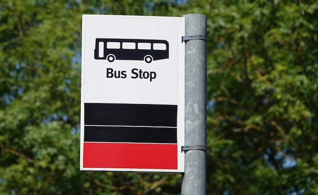 a bus stop sign that says bus stop on it