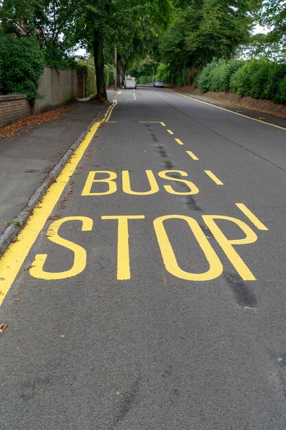 Bus stop text on road