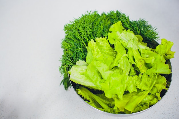 Bushy lettuce salad in metal bowl