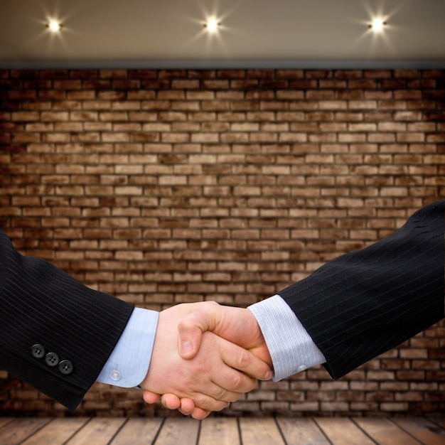 Busines man handshake with modern interior background