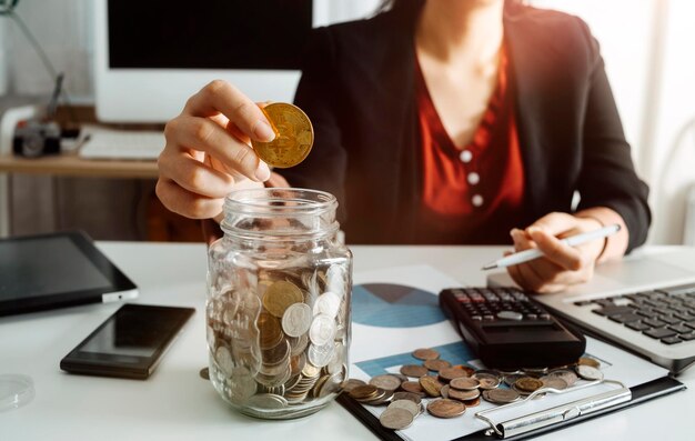 Business accounting concept Business man using calculator with computer laptop budget and loan paper in office