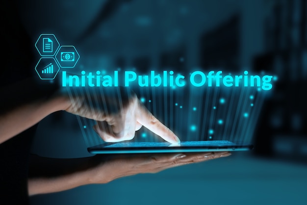 Business acronym ipo or initial public offering person holding a tablet