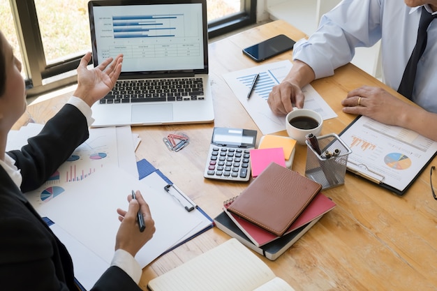 Photo business adviser analyzing financial figures denoting the progress internal revenue service checking document. audit concept