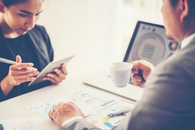 Photo business adviser analyzing financial figures denoting the progress