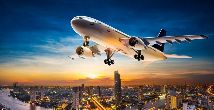 Photo business aeroplane take of over the cityscape on beautiful sunset