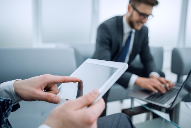 Business backgroundbusinessman with digital tablet on office backgroundpeople and technology