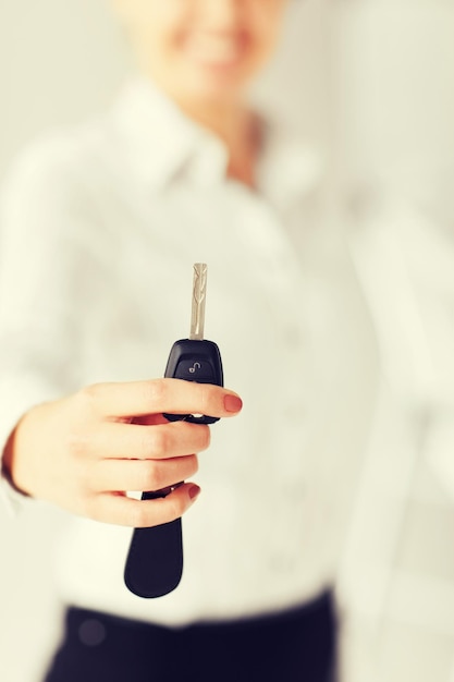 business, banking, vehicle, rental, automotive concept - woman hand holding car key