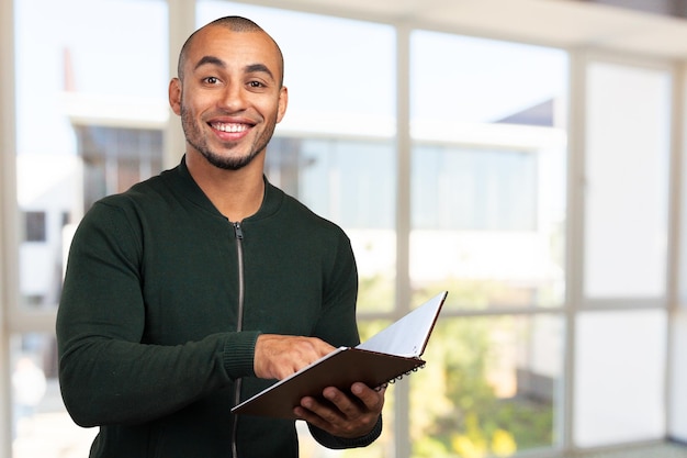 Business black man holding a book