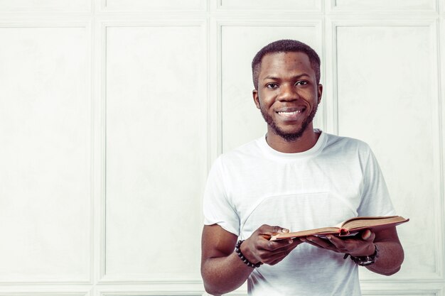 Business black man holding a book