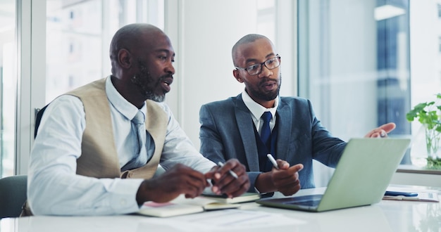 Business black men and laptop in office on meeting for ideas on project with teamwork and collaboration Employee discussion and boardroom with research for partnership and strategy as lawyers