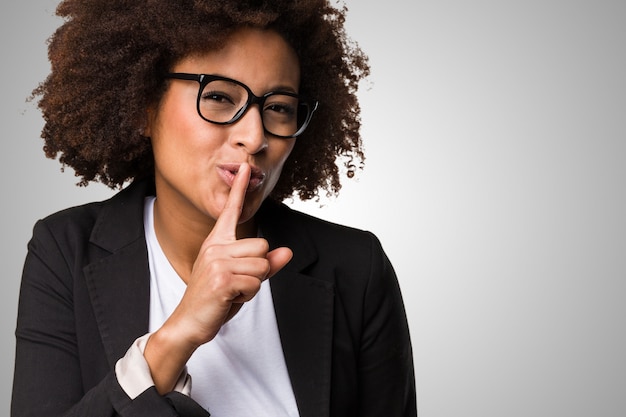 business black woman doing silence gesture