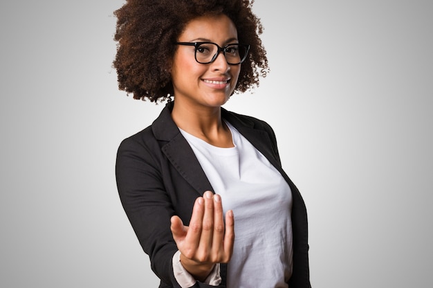 business black woman inviting someone to come