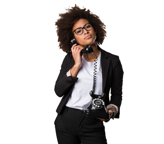 business black woman talking on telephone