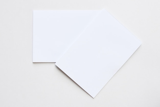 Business blank white card placed on the desk top view.