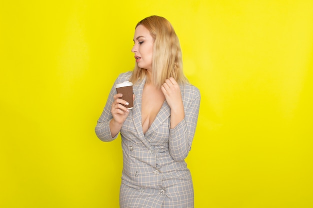Business blonde woman with cup of coffee
