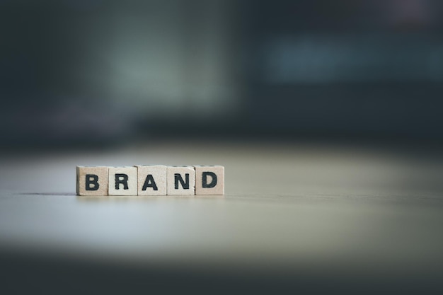 Photo business brand and identity concept close up picture of wooden cubes with the word brand