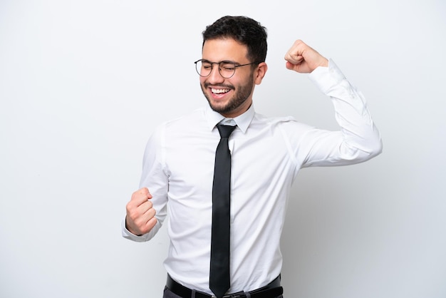 Business Brazilian man isolated on white background celebrating a victory