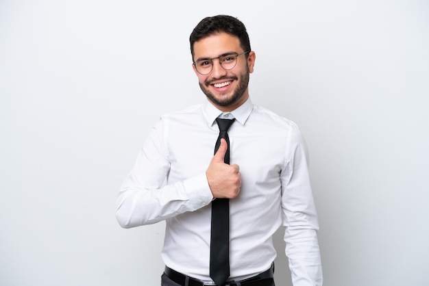 Business Brazilian man isolated on white background giving a thumbs up gesture