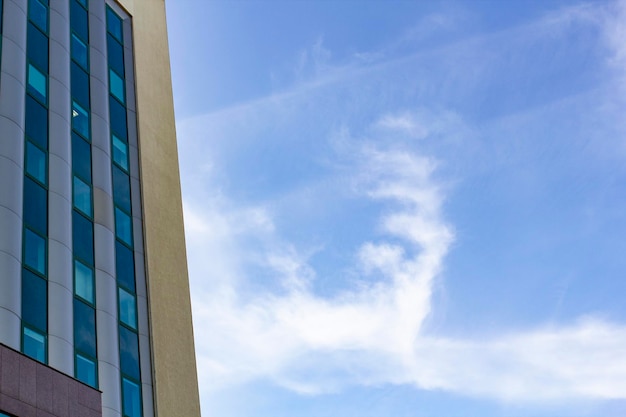 Business building against cloud in the sky