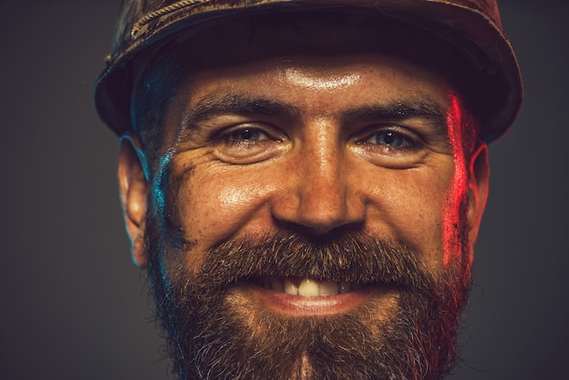 Business, building concept - smiling builder in hard hat. Portrait of mechanical worker. Portrait of handsome engineer.