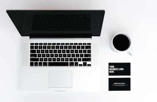 Business card mockup and laptop