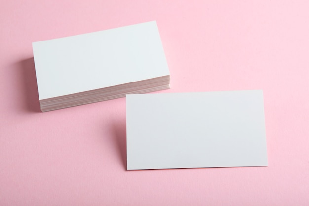 Photo business cards on a colored background top view place to insert text