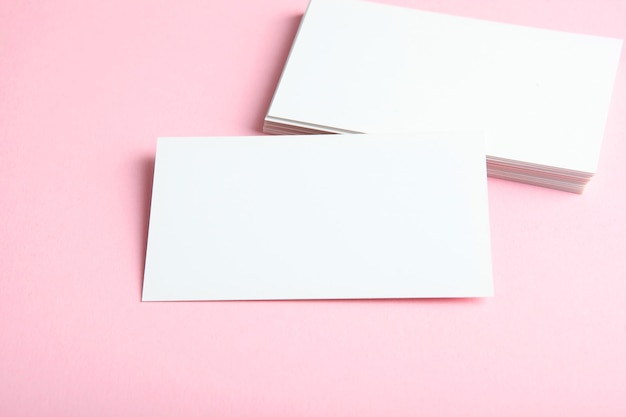 Business cards on a colored background top view place to insert text