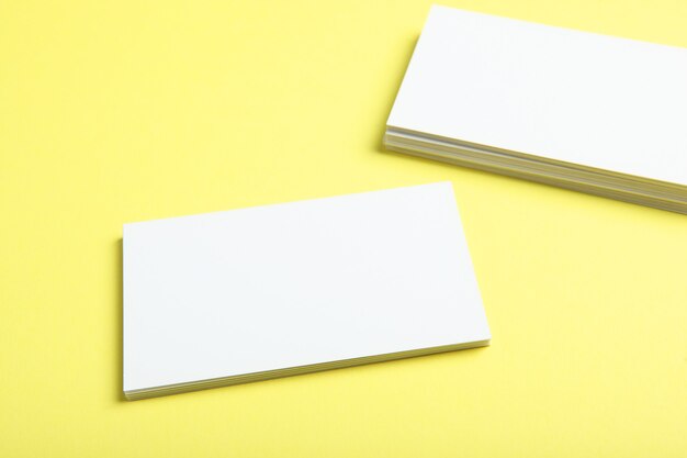 Business cards on a colored background top view place to insert text