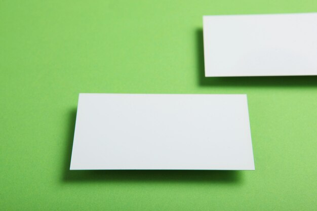 Business cards on a colored background top view place to insert text