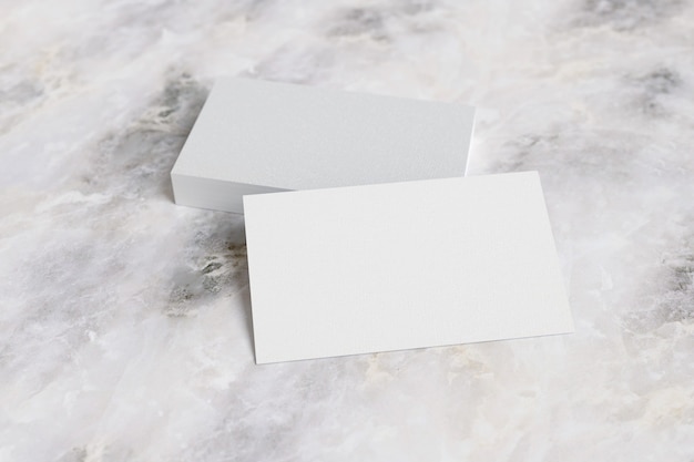 Business cards on marble surface.