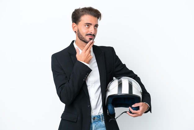 Business caucasian man isolated on white background looking up while smiling