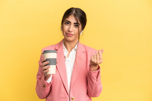 Photo business caucasian woman isolated on yellow background making money gesture