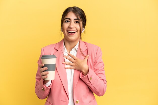 Business caucasian woman isolated on yellow background surprised and shocked while looking right