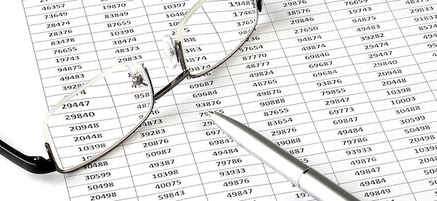 Business chart, pen and glasses on the white background