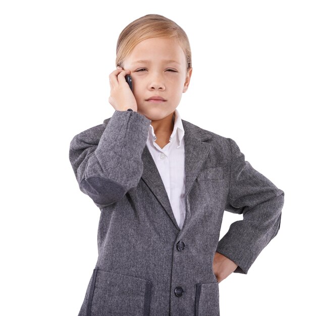 Photo business child and phone call in studio with anger feedback and connection problem or sales deal failure little girl cross and smartphone to pretend as boss and bad service by white background